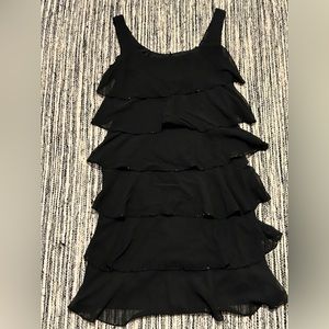 Patra tiered sleeveless embroidered black mini dress. Previously owned/used.